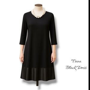 Elegant Black Dress with Pearl Necklace